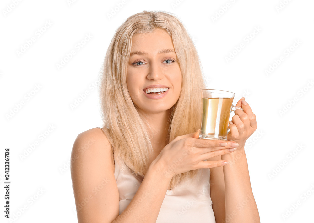 Beautiful young woman with tea on white background Beautiful young woman with tea on white background