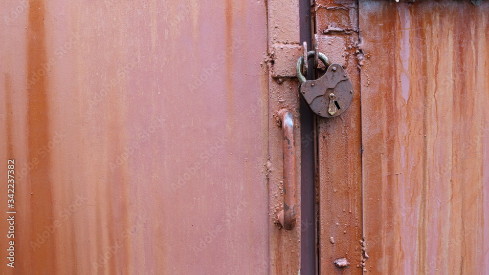 padlock on closed metal doors padlock on closed metal doors