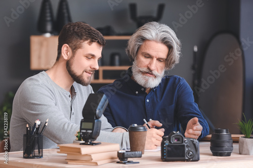 Mentor teaching young photo...