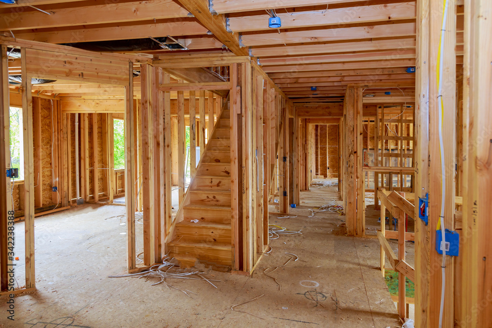 Fototapeta premium Wooden beams and wall to ceiling framed building residential home construction interior