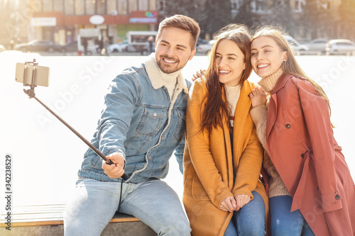Happy friends taking selfie...