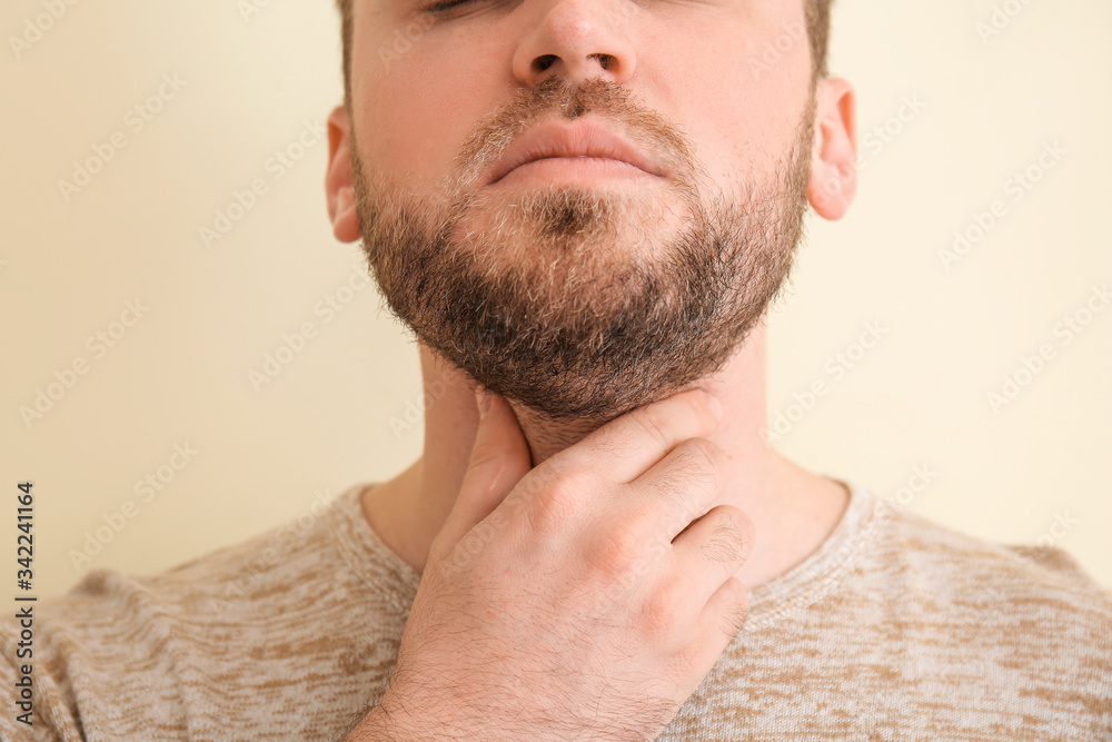 Naklejka premium Man Touching Throat Due to Pain
