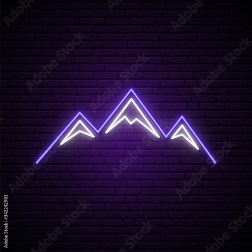 Mountains neon sign. Shiny mountain tops silhouette on dark brick wall background. Vector design template for logo, emblem, tourism advertising, etc.