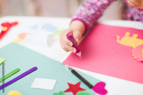 toddler girl making craft for homeschooling