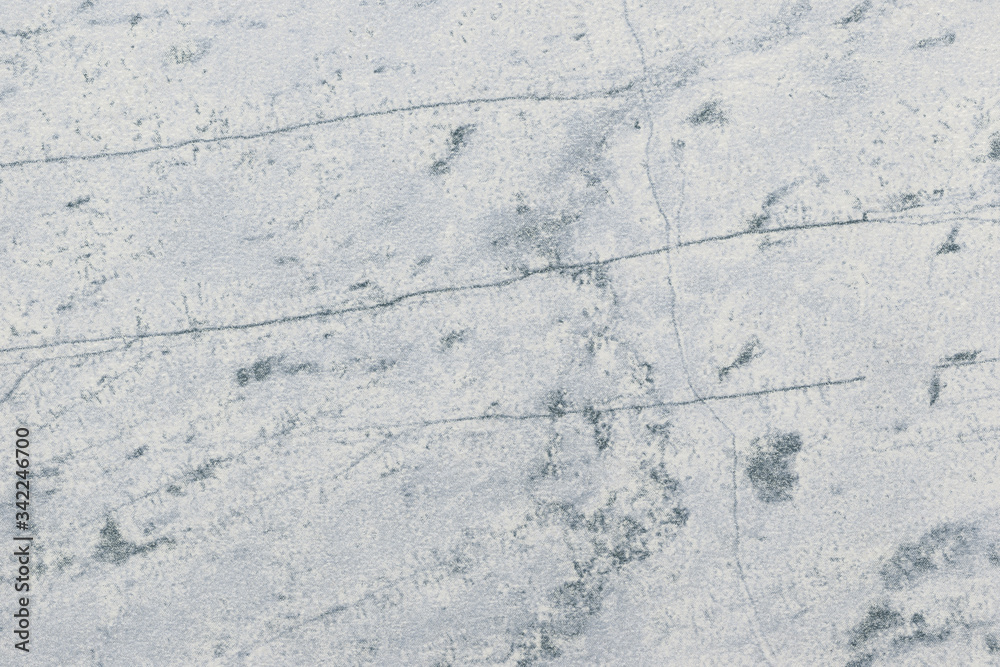 Texture of light gray old marble material with cracked pattern, macro background. Structure of white ancient stone. Texture of light gray old marble material with cracked pattern, macro background. Structure of white ancient stone.