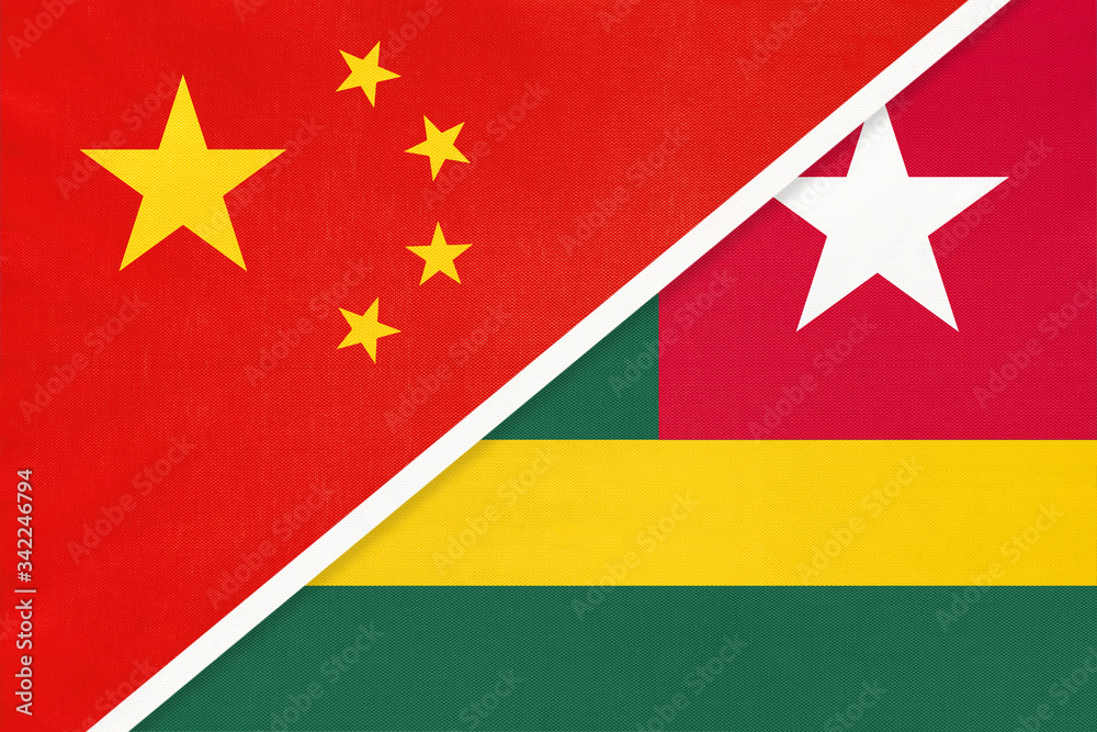 China or PRC vs Togo national flag from textile. Relationship between Asian and African countries. China or PRC vs Togo national flag from textile. Relationship between Asian and African countries.