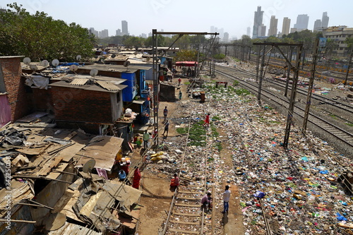 MUMBAI, INDIA - February 7, 2019: Suburban Railway near Dharavi Slum at Mumbai India. Top view