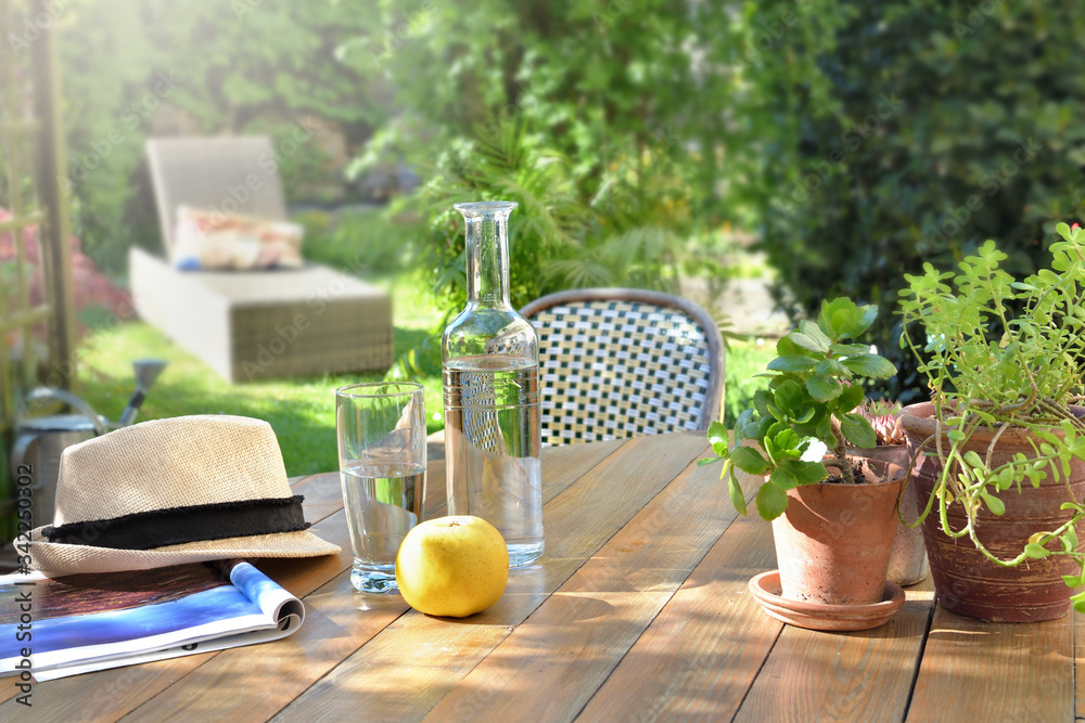 close on drink  glass and apple on a wooden table in garden  background in summer - obrazy, fototapety, plakaty 