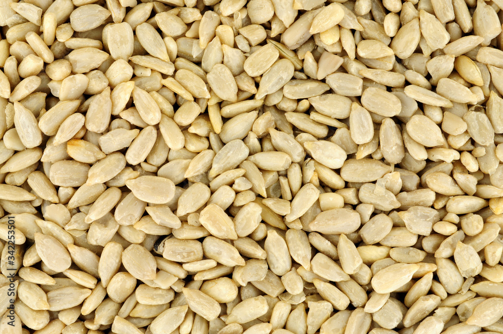 Protein rich sunflower seed kernel hearts background Protein rich sunflower seed kernel hearts background