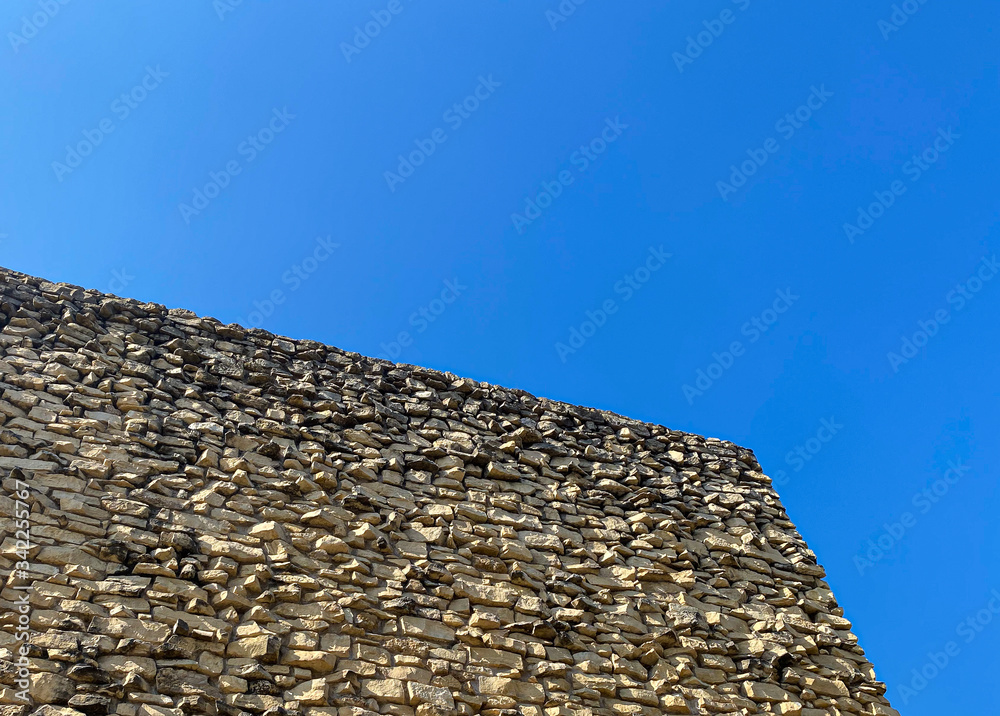 stone rock building blue sky