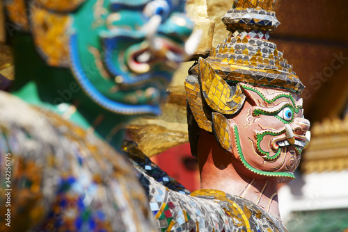 colorful tradition demon statue which support golden pagoda