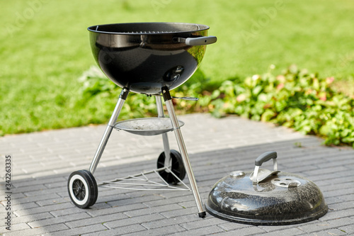 Fototapeta bbq and grilling concept - grill brazier outdoors