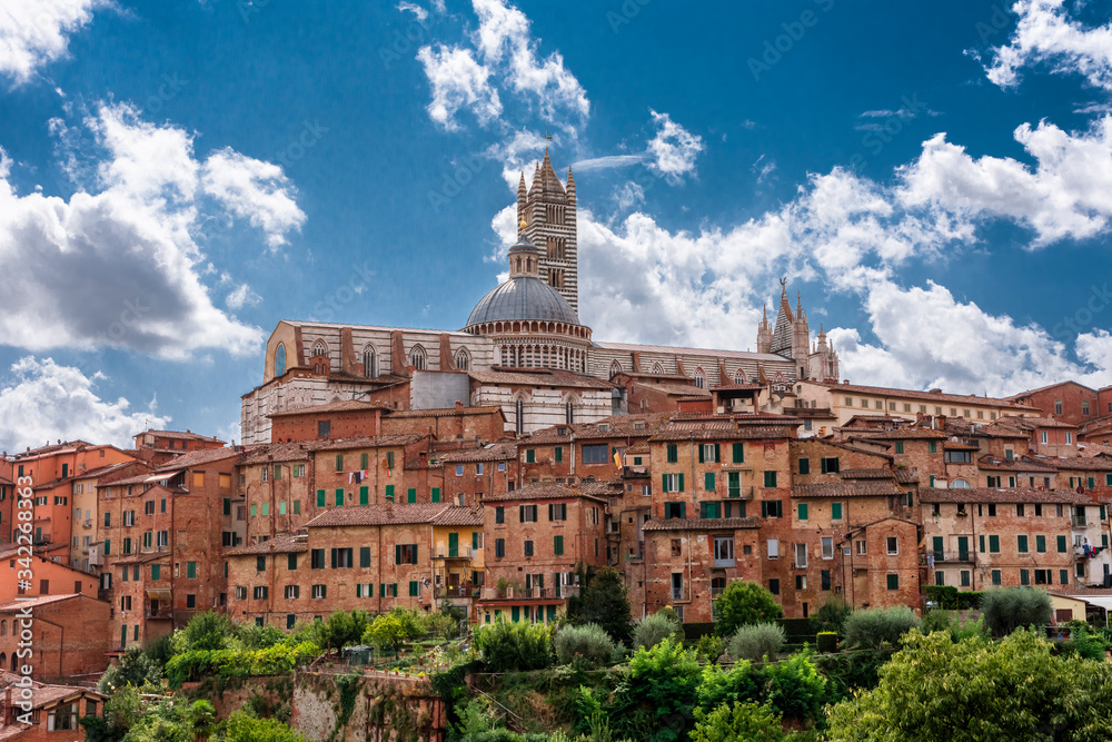 panorama of Tuscany town, Italy, with vivid colors and beautiful clowds on blue sky