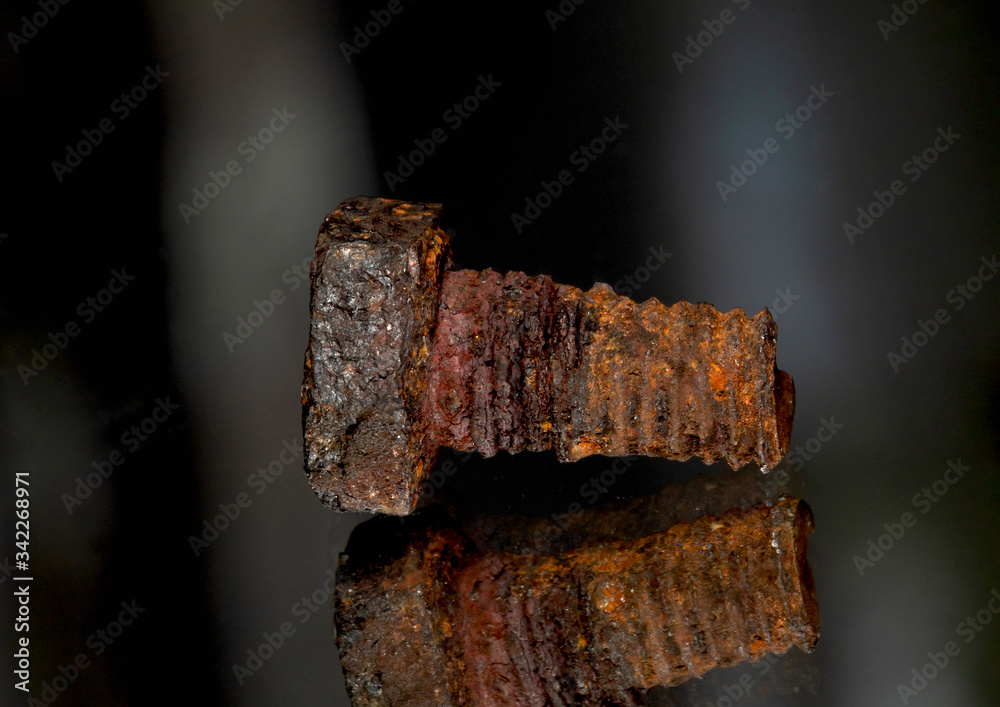 Rusted screw closeup view on black background Rusted screw closeup view on black background