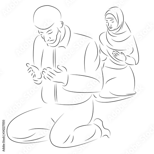 Muslim husband and wife pray