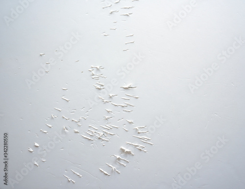 White paper board with scratches showing broken surface by cat claws. Background, texture and abstract. 