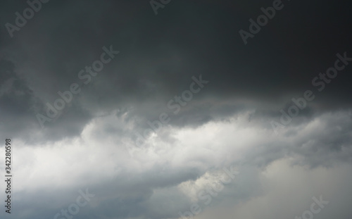 Dark cloud in the sky showing the coming rain storm.  Meteorology, climate, weather and nature categories.