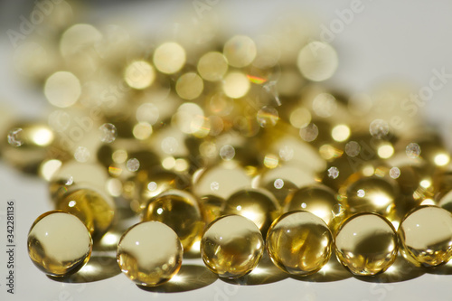 Capsules with medication, close-up, gelatin tablets with oil, vitamin or collagen.