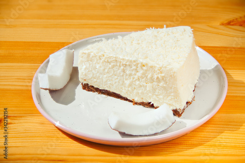 delicious cheesecake with coconut on plate