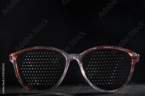 Training glasses isolated on a black background, front view