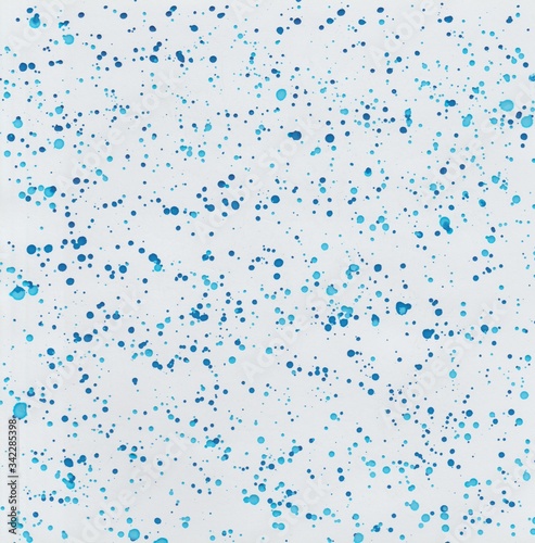 Watercolor background with paint splashes in dark blue and light blue