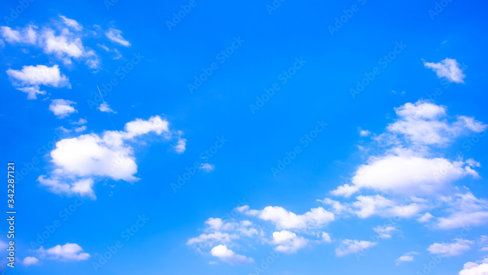 Beautiful blue summer sky with fluffy clouds as a background Beautiful blue summer sky with fluffy clouds as a background