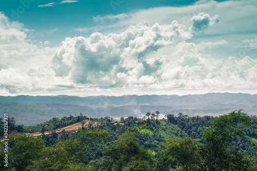 Landscape of mountain green forest and clouds sky