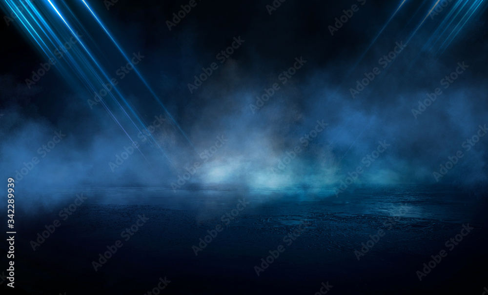 Dark street, wet asphalt, reflections of rays in the water. Abstract dark blue background, smoke, smog. Empty dark scene, neon light, spotlights. Concrete floor