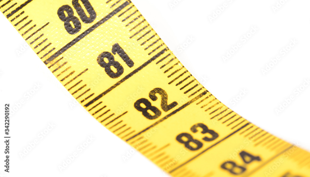 Close-up of a yellow measuring tape isolated on white - 81 Close-up of a yellow measuring tape isolated on white - 81