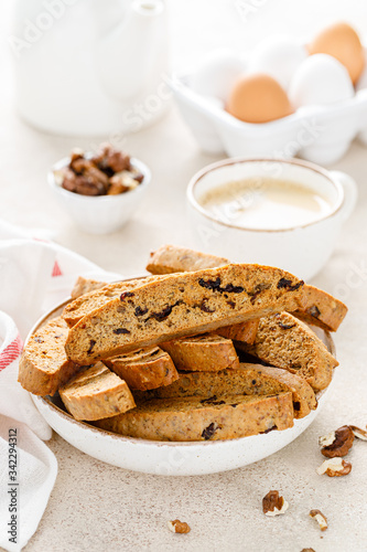 Biscotti cookies with dried cranberry, walnuts and with a cup of coffee