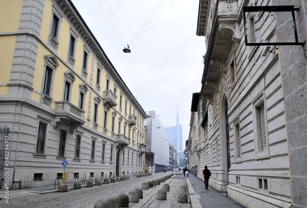 Old Italian city Milan urban architecture cityscape ancient buildings history cobblestone street panorama background 