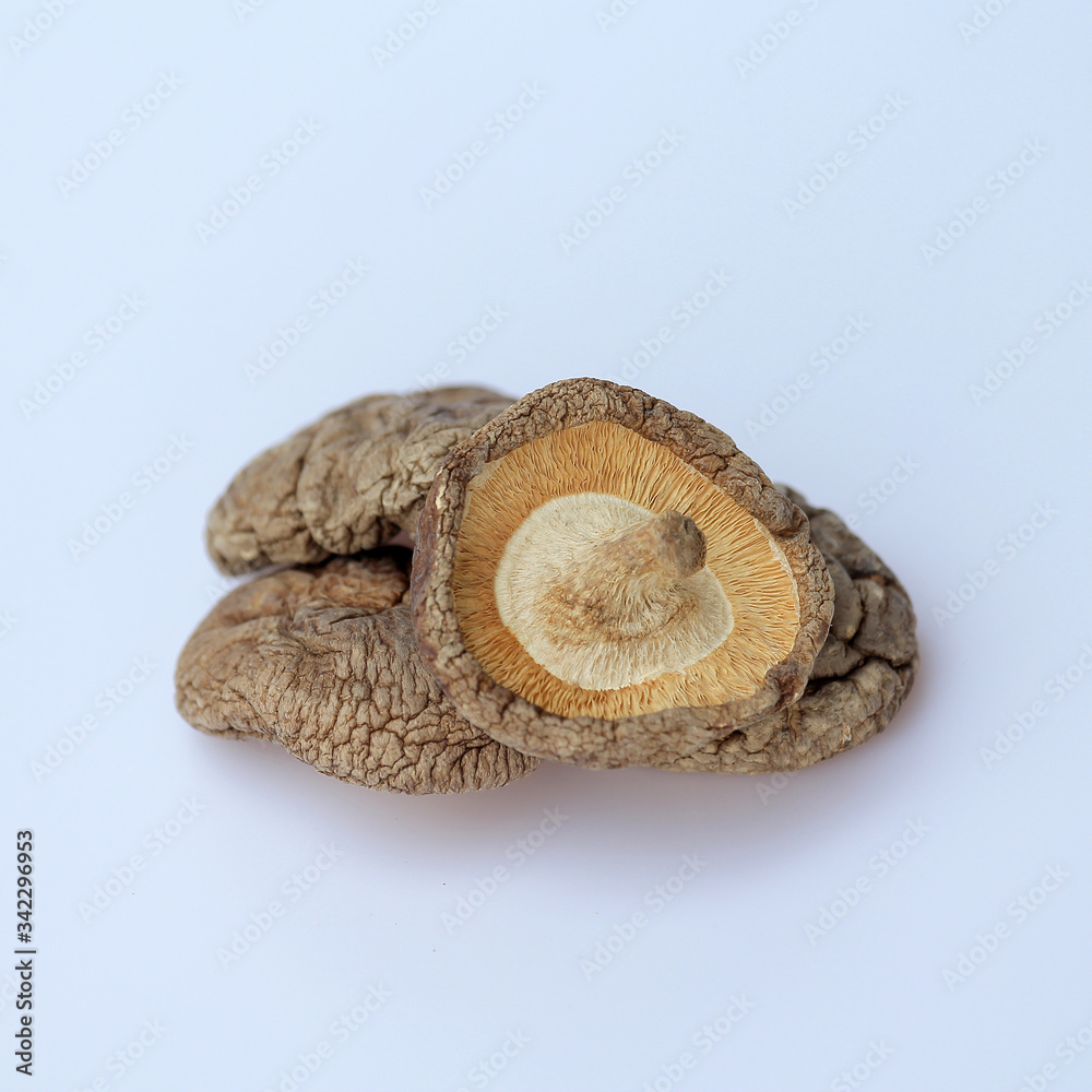 Isolated and close up dried shiitake mushroom ,element of food healthy nutrients concept on white background.
Isolated and close up dried shiitake mushroom ,element of food healthy nutrients concept on white background.