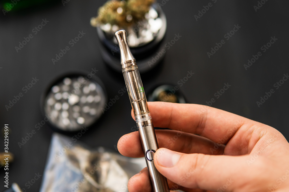 CBD and THC on buds in cannabis. Cannabis buds on black wood Stock