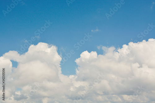 Fluffy White Clouds with Clear Blue Sky