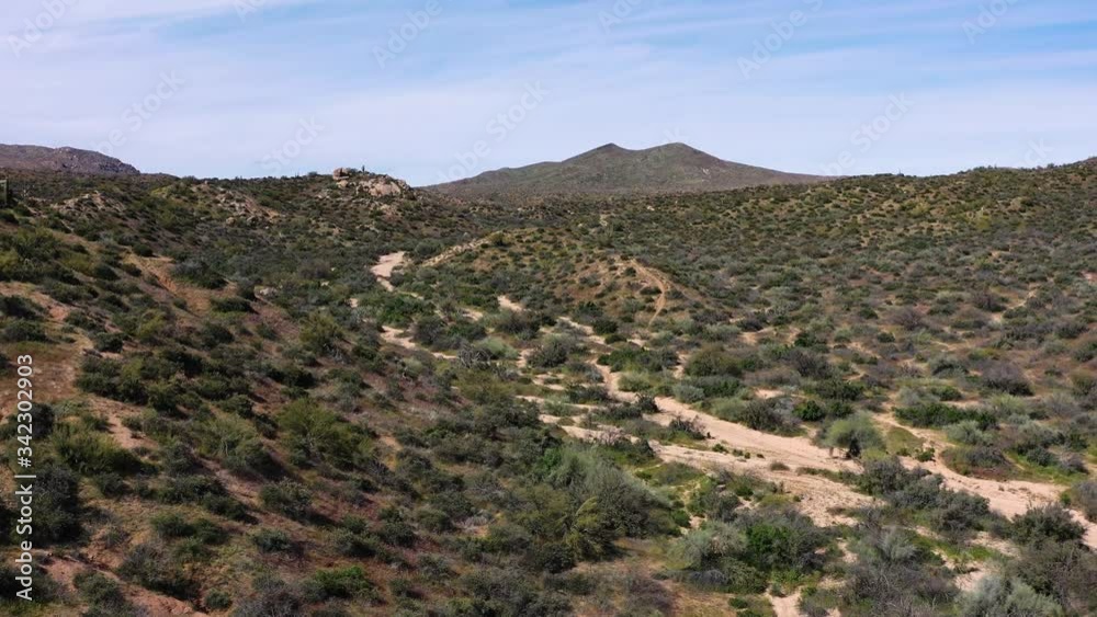 Aerial pull back to reveal a huge dry wash leading to a corral in the middle of the Sonoran Desert, Tonto National Forest, Scottsdale, Arizona Aerial pull back to reveal a huge dry wash leading to a corral in the middle of the Sonoran Desert, Tonto National Forest, Scottsdale, Arizona