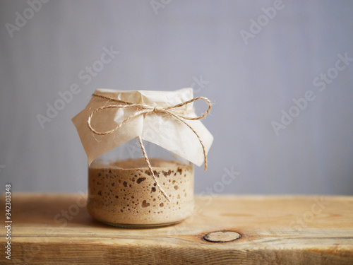 Homemade bread sourdough in a glass jar. photo