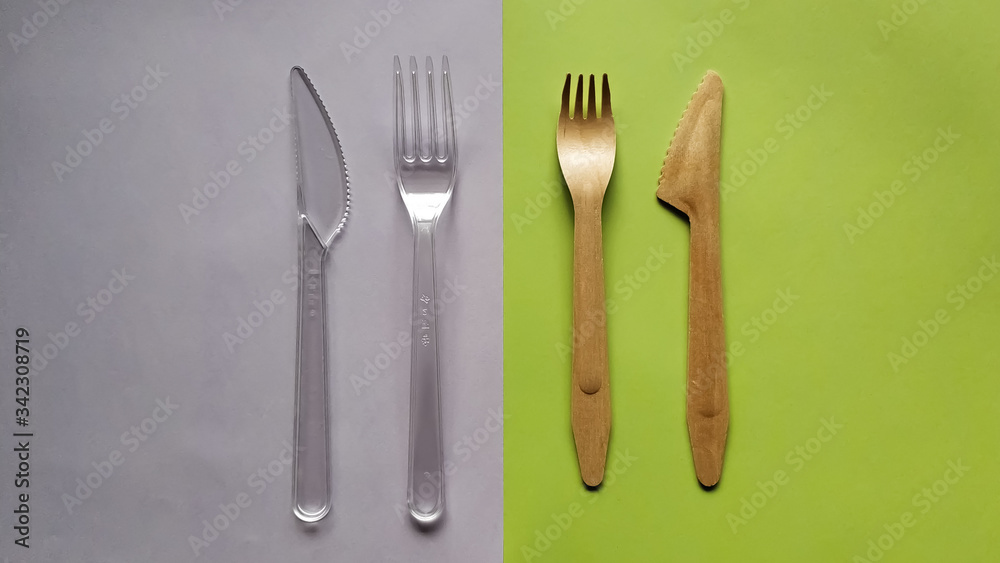 Contrast plastic and bamboo wooden fork knife. Eco-friendly disposable cutlery Contrast plastic and bamboo wooden fork knife. Eco-friendly disposable cutlery
