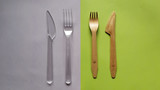 Contrast plastic and bamboo wooden fork knife. Eco-friendly disposable cutlery