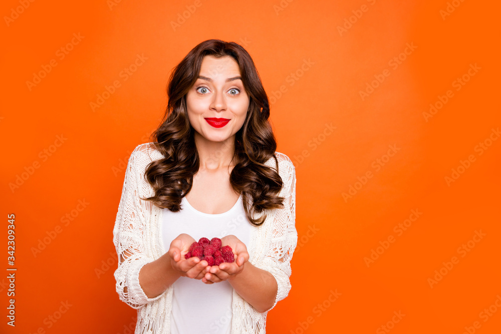 Photo of beautiful summer lady enjoy vacation holding fresh raspberry offering try wearing light beach cape white underwear suit isolated bright orange background Photo of beautiful summer lady enjoy vacation holding fresh raspberry offering try wearing light beach cape white underwear suit isolated bright orange background