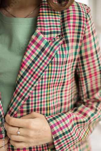 Checkered casual jacket. Girl in a jacket