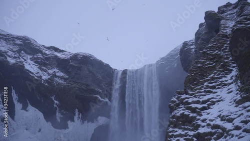 Wallpaper Mural Skógafoss waterfall during the Icelandic winter.
 Torontodigital.ca