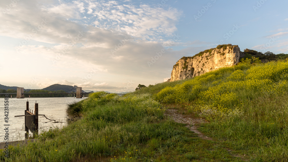 end of the day on the banks of the Rhone with a view of the cliffs of Donzere, France