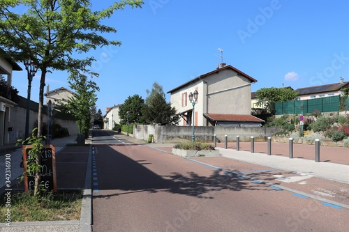 Fototapeta Naklejka Na Ścianę i Meble -  La rue Centrale à Corbas - Village de Corbas - Département du Rhône - France