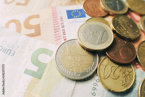 Euro bills and coins, financial Corona Virus crisis.