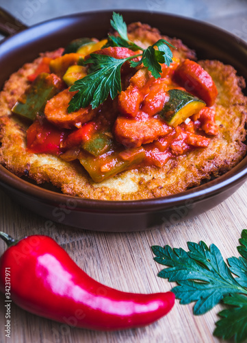 Fresh potato pancakes with vegetables served in a pan, traditional in Polish cuisine, traditional in Polish cuisine