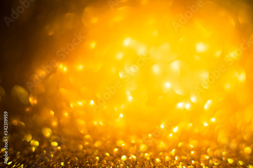 Abstract of Bright and sparkling bokeh background. golden and diamond dust bokeh -blurred lighting from glitter texture. Blue color Luxury design background.