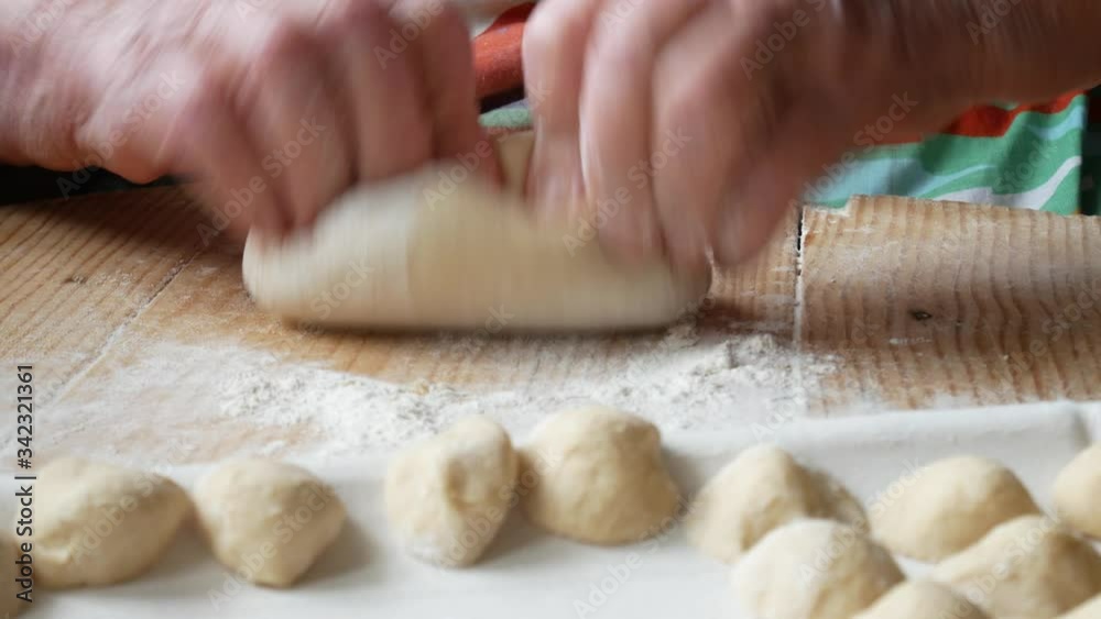 hands of elderly woman making homemade pasta orecchiette. typical food of southern Italy
hands of elderly woman making homemade pasta orecchiette. typical food of southern Italy