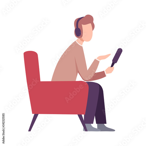 Male Journalist Making Interview, Professional Reporter Character with Microphone and Headphones Sitting in Armchair Flat Vector Illustration