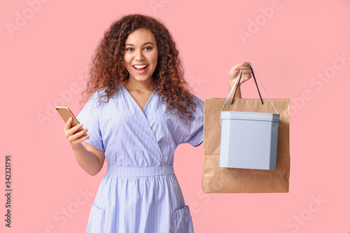 Young woman with mobile pho...