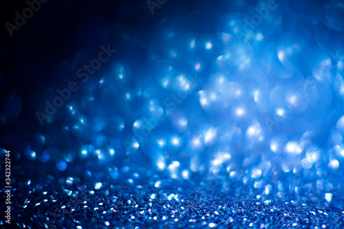 Abstract blue glitter background. Shiny glitter bokeh christmas background